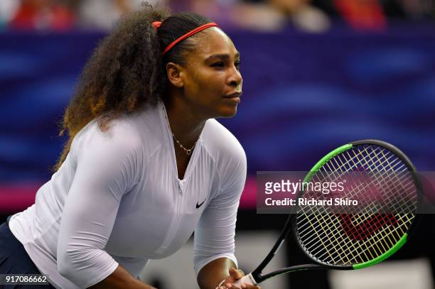Serena Williams of Team USA waits on a serve from Lesley Kerkhove and Demi Schuurs of the Netherlands during a doubles match in the first round of...