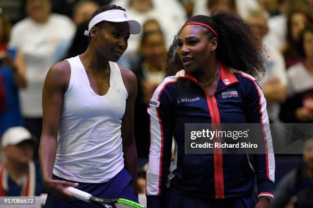 Venus Williams and Serena Williams of Team USA talk before competing against Lesley Kerkhove and Demi Schuurs of the Netherlands in a doubles match...