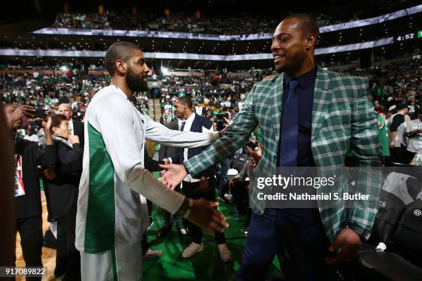 Kyrie Irving of the Boston Celtics greets Paul Pierce during the game against the Cleveland Cavaliers on February 11, 2018 at TD Garden in Boston,...