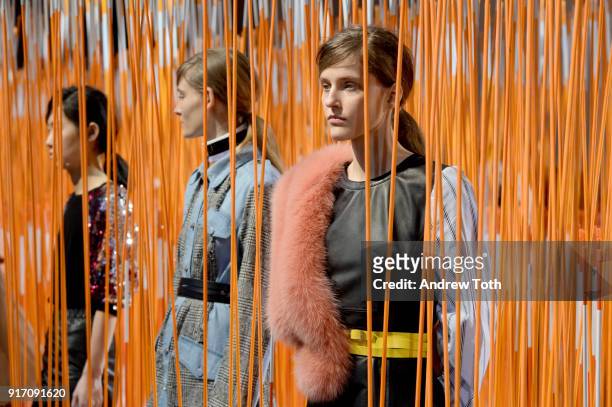 Models pose for Tanya Taylor presentation during New York Fashion Week: The Shows at Gallery II at Spring Studios on February 11, 2018 in New York...