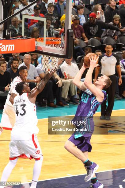 Cody Zeller of the Charlotte Hornets drives to the basket during the game against the Toronto Raptors on February 11, 2018 at Spectrum Center in...