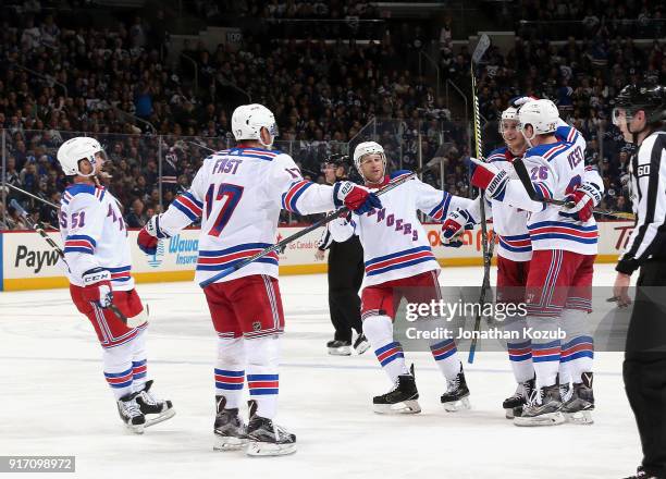 David Desharnais, Jesper Fast, Steven Kampfer, Brady Skjei and Jimmy Vesey of the New York Rangers celebrate a third period goal against the Winnipeg...