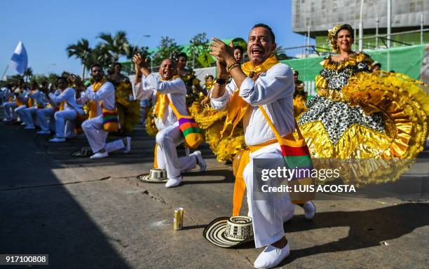 Revellers named "Cumbiambas" dance during the Carnival parade in Barranquilla, Colombia on February 11, 2018. / AFP PHOTO / Luis ACOSTA