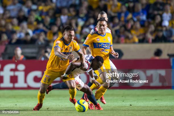 Eduardo Vargas of Tigres fights for the ball with Renato Ibarra of America during the 6th round match between Tigres UANL and America as part of the...