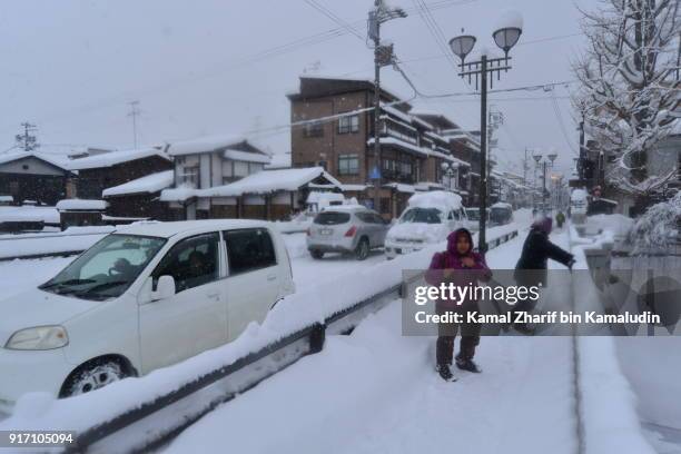 tourist walking at takayama snowy town - chilly bin stock pictures, royalty-free photos & images