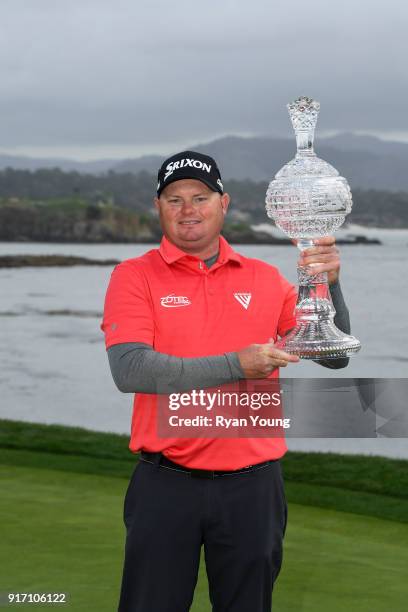 Ted Potter Jr. Poses for photographs with the trophy following the final round of the AT&T Pebble Beach Pro-Am at Pebble Beach Golf Links, on...