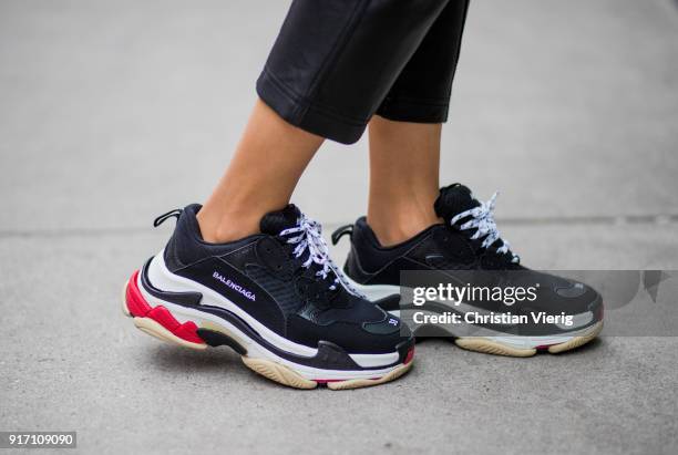 Maria Hatzistefanis wearing black Marissa Webb pants, Off White belt, Awake knit, black Balenciaga sneakers, white Balenciaga bag, Moncler sunglasses...