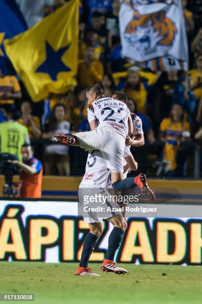 Jeremy Menez of America celebrates with teammate Paul Aguilar after acoring goal that was declared null during the 6th round match between Tigres...
