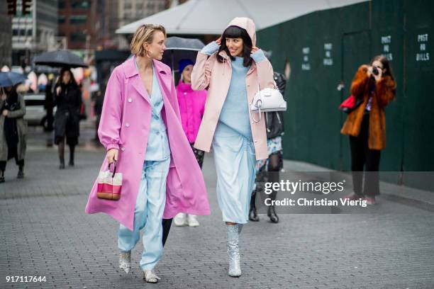 Rebecca Laurey wearing pink coat, blue suit and Babba Canales Rivera seen outside Tibi on February 11, 2018 in New York City.