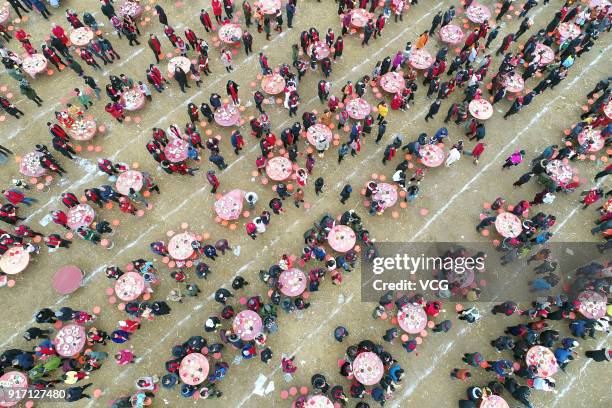 Aerial view of villagers eat and enjoy an art performance together at Anzhou District on February 11, 2018 in Mianyang, Sichuan Province of China....