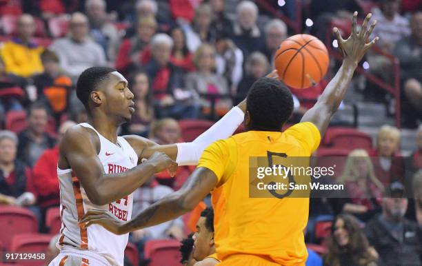 Brandon McCoy of the UNLV Rebels passes against Alan Herndon of the Wyoming Cowboys during their game at the Thomas & Mack Center on February 10,...