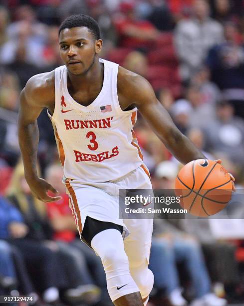 Amauri Hardy of the UNLV Rebels brings the ball up the court against the Wyoming Cowboys during their game at the Thomas & Mack Center on February...