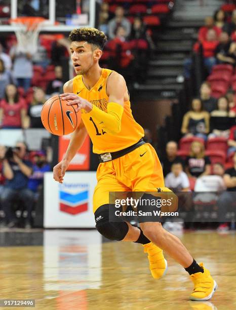 Hunter Maldonado of the Wyoming Cowboys dribbles against the UNLV Rebels during their game at the Thomas & Mack Center on February 10, 2018 in Las...