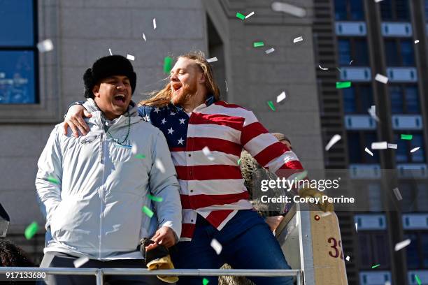 Destiny Vaeao and Beau Allen of the Philadelphia Eagles celebrate with Allen adorned in his flag shirt during festivities on February 8, 2018 in...