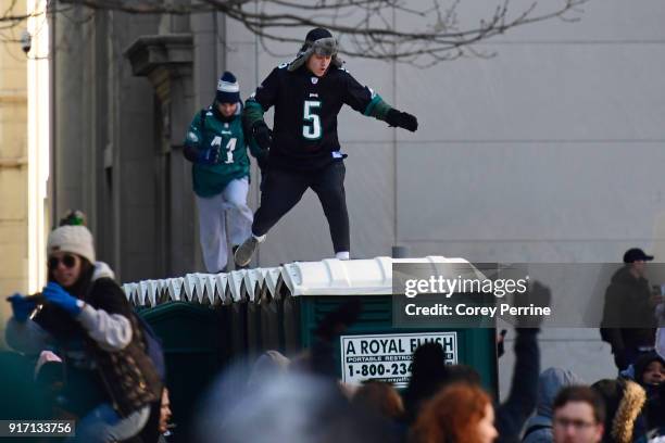 Eagles fans run atop portable urinals during festivities on February 8, 2018 in Philadelphia, Pennsylvania. The city celebrated the Philadelphia...