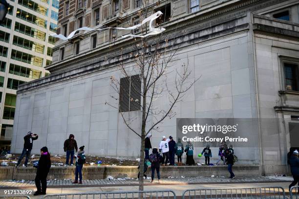 Eagles fans look on after the parade concludes during festivities on February 8, 2018 in Philadelphia, Pennsylvania. The city celebrated the...