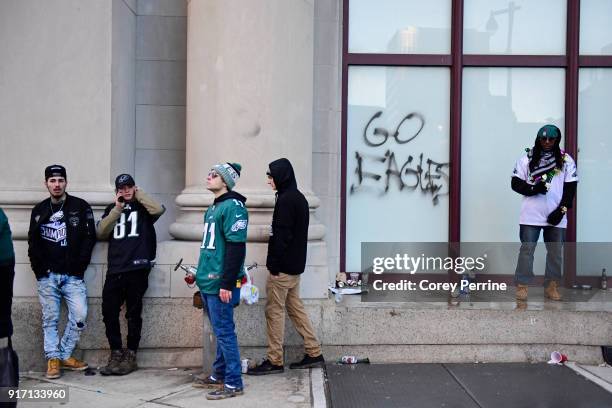 Eagles fans hang around downtown after the parade concludes during festivities on February 8, 2018 in Philadelphia, Pennsylvania. The city celebrated...