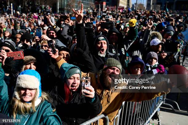 Todd Ogden of Cape May, New Jersey hangs his tongue out as he chews with other Eagles fans during festivities on February 8, 2018 in Philadelphia,...