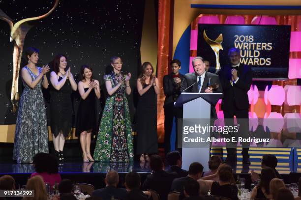 Writer-producer Bruce Miller and the writers of 'The Handmaid's Tale' accept the Drama Series award onstage during the 2018 Writers Guild Awards L.A....