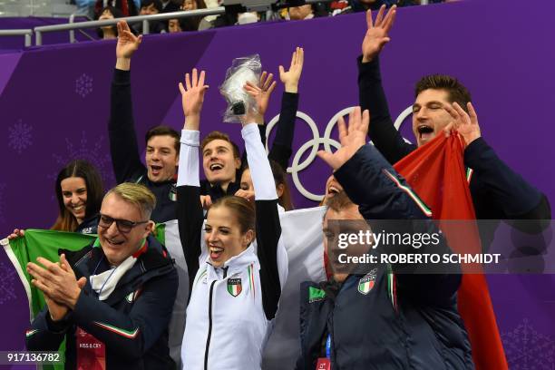 Italy's Carolina Kostner reacts after competing in the figure skating team event women's single skating free skating during the Pyeongchang 2018...