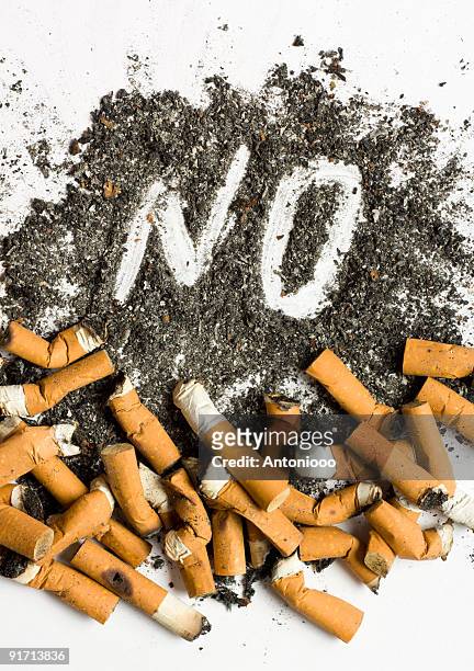 no smoking sign made of cigarette butts and ash - anti smoking stock pictures, royalty-free photos & images