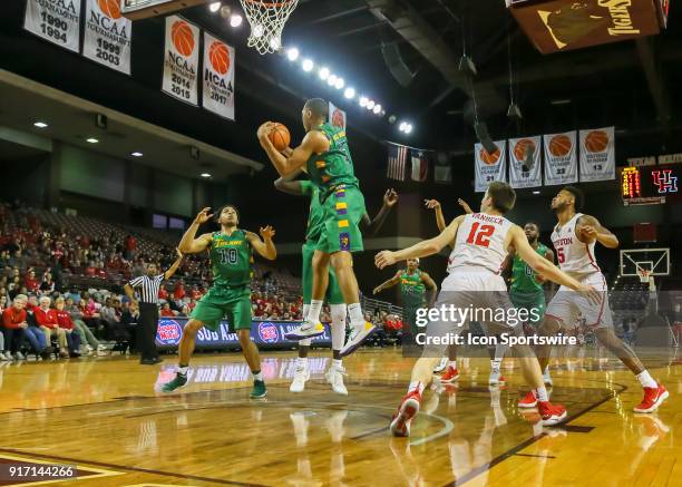 Tulane Green Wave guard Cameron Reynolds gets the rebound during the Men's basketball game between the Tulane Green Wave and Houston Cougars on...