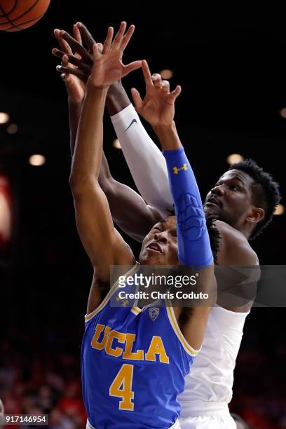 Deandre Ayton of the Arizona Wildcats and Jaylen Hands of the UCLA Bruins fight for a rebound during the second half of the college basketball game...