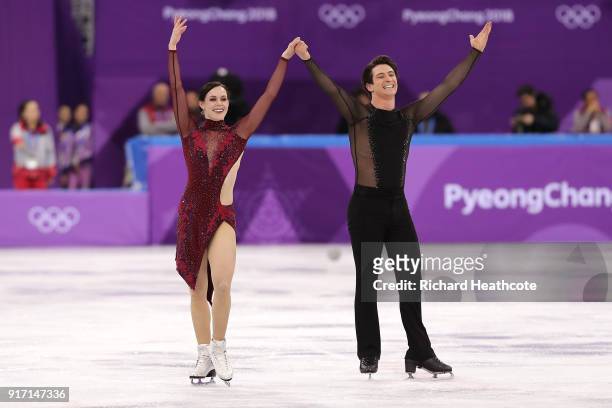 Tessa Virtue and Scott Moir of Canada react after their routine in the Figure Skating Team Event  Ice Dance Free Dance on day three of the...