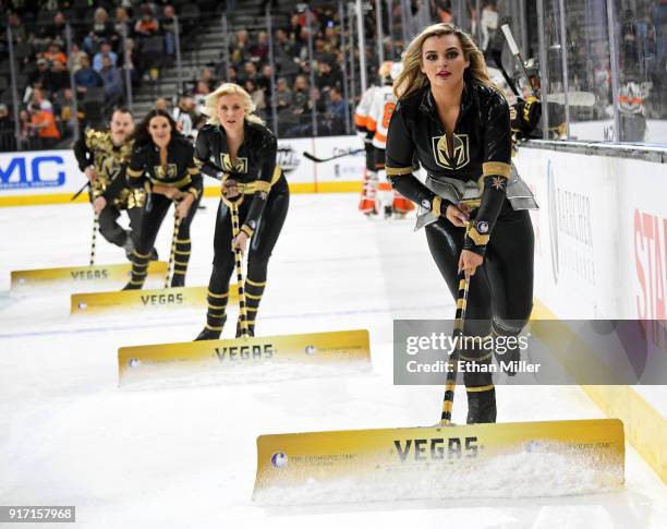 Members of the Knights Crew clean the ice during the Vegas Golden Knights' game against the Philadelphia Flyers at T-Mobile Arena on February 11,...