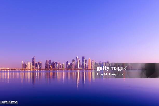 the downtown doha city skyline at sunset, qatar - doha sunset stock pictures, royalty-free photos & images