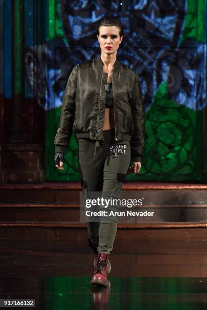 Model walks the runway during the MisterTripleX presentation during New York Fashion Week Powered by Art Hearts Fashion NYFW at The Angel Orensanz...