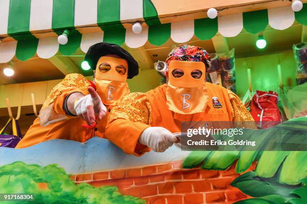 Chefs Chris Wilson and Emeril Lagasse ride in the 2018 Krewe of Bacchus parade on February 11, 2018 in New Orleans, Louisiana.