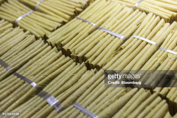 Bundles of dried tofu skin are displayed for sale at a food exhibition in Shanghai, China, on Sunday, Feb. 11, 2018. For China, volatile food prices,...