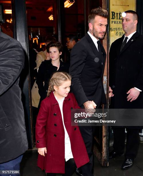 Cruz Beckham, Harper Beckham and David Beckham arrive to Balthazar on February 11, 2018 in New York City.