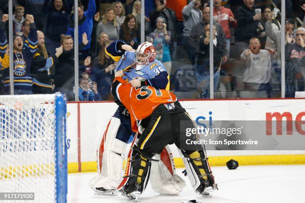 Toledo Walleye goalie Matej Machovsky, of the Czech Republic, and Kansas City Mavericks goalie Mason McDonald fight during a line brawl during the...