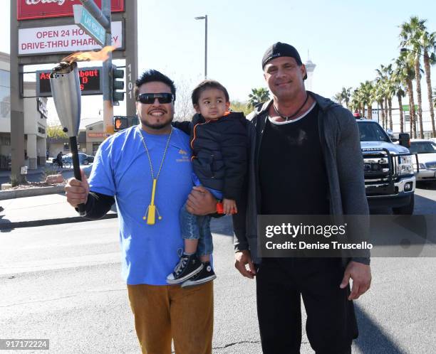 Jose Conseco walks with a Candlelighter family during Candlelighters Childhood Cancer Foundation Of Nevada's torch relay, commemorating the...