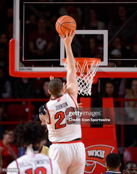 Western Kentucky Hilltoppers forward Justin Johnson shoots over Florida International Golden Panthers guard Eric Lockett during the second half...