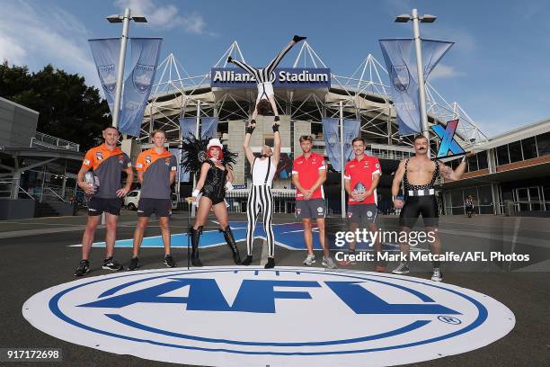 Dane Rampe and Jake Lloyd of the Sydney Swans and Tom Scully and Lachie Whitfield of GWS Giants pose with performers during the Sydney AFLX launch at...