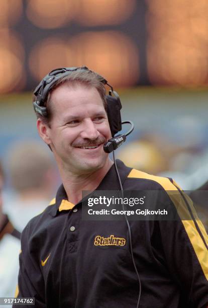 Head coach Bill Cowher of the Pittsburgh Steelers smiles as he looks on from the sideline during a game against the Tennessee Oilers at Three Rivers...