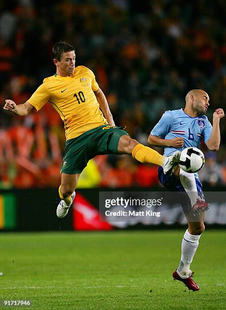 Harry Kewell of the Socceroos and Demy de Zeeuw of the Netherlands compete for the ball during the International friendly football match between...