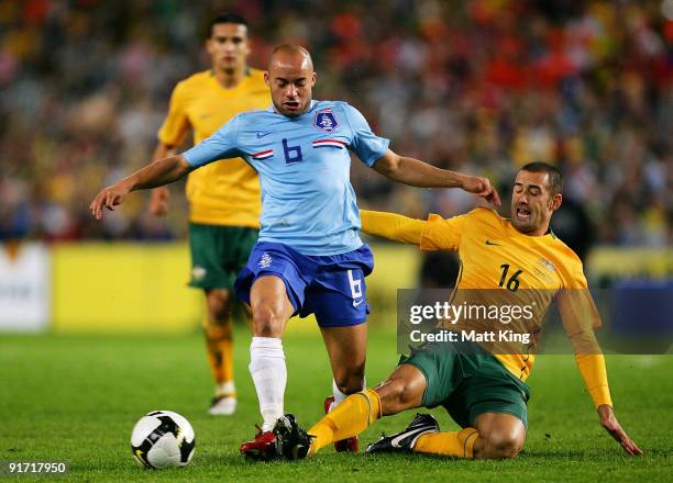 Demy de Zeeuw of the Netherlands is tackled by Carl Valeri of the Socceroos during the International friendly football match between Australia and...