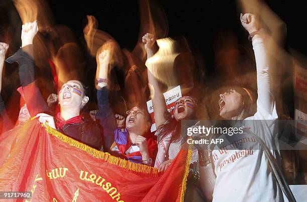 Armenian protestors march through the capital of Yerevan on October 9, 2009. Thousands of Armenians took to the streets of the capital Yerevan to...