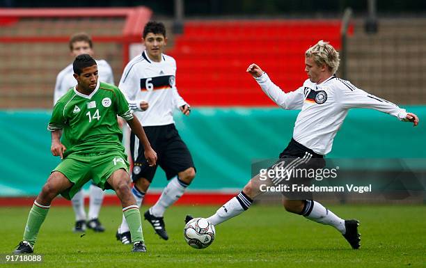 Christopher Buchtmann of Germany and Med-Lamin Omrani of Algeria challenge for the ball during the U18 International Friendly match between Germany...