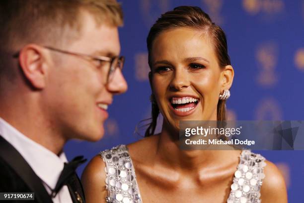 Adam Zampa speaks to media as partner Harriet Palmer reacts at the 2018 Allan Border Medal at Crown Palladium on February 12, 2018 in Melbourne,...