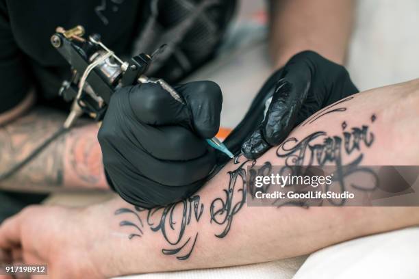 tattooing - fore arm stock pictures, royalty-free photos & images