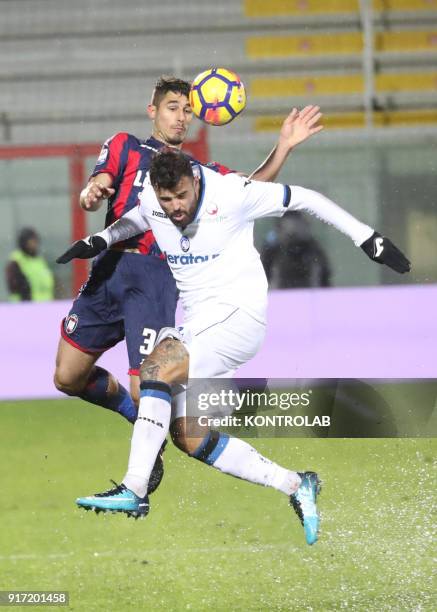 Crotone's Italian defender Davide Faraoni heads the ball as fighting with Atalanta'a Italian forward Andrea Petagna during the Italian Serie A...