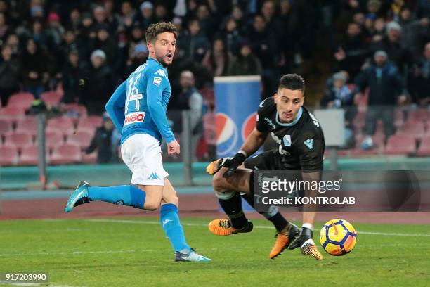 Napoli's Belgian striker Dries Mertens scores against Lazio's Albanian goalkeeper Thomas Strakosha during the Italian Serie A football match SSC...