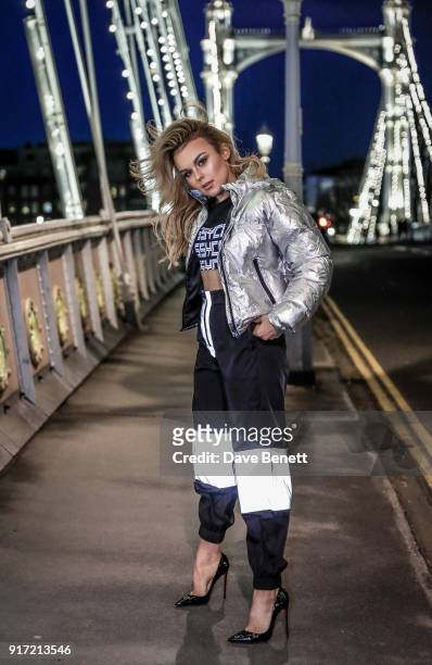 Tallia Storm wearing Dolls Kill trousers, top and jacket with Christian Louboutin shoes on February 11, 2018 in London, England.