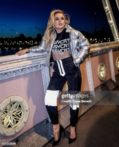 Tallia Storm wearing Dolls Kill trousers, top and jacket with Christian Louboutin shoes on February 11, 2018 in London, England.