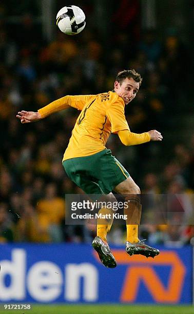 Luke Wilkshire of the Socceroos heads the ball during the International friendly football match between Australia and the Netherlands at Sydney...